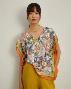 Blusa estilo poncho com padrão tropical