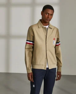 Blusão de algodão com pormenor de riscas e bolso no peito