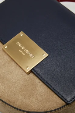 Bolsa semicircular em camurça e pele