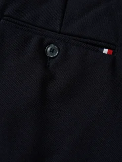 Calças chino regular fit com pregas