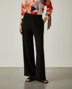 Calças de corte direito com cintura elástica