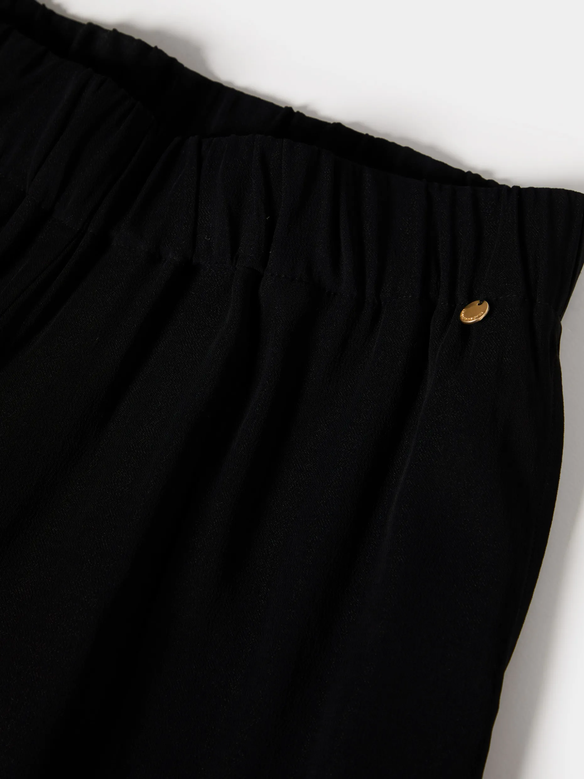 Calças de corte direito com cintura elástica