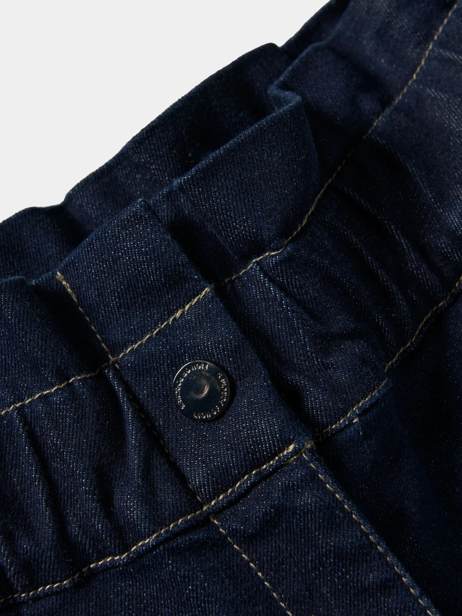 Calças denim com folho