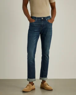 Calças denim lavagem escura slim fit