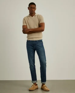 Calças denim lavagem escura slim fit