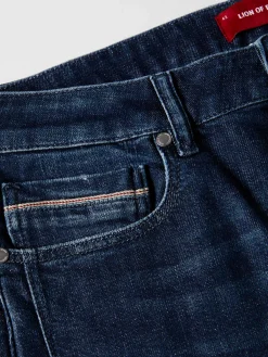 Calças denim lavagem escura slim fit