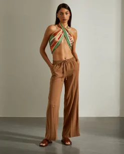 Calças fluidas de perna larga com cordão