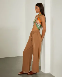 Calças fluidas de perna larga com cordão