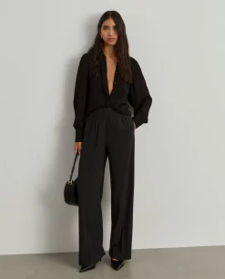 Calças largas com cintura elástica