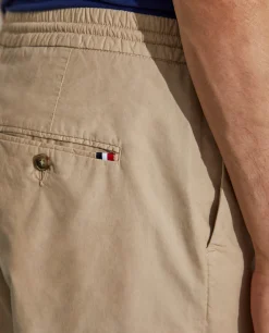 Calças regular fit de algodão com cordão