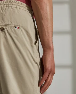 Calças regular fit de algodão com cordão