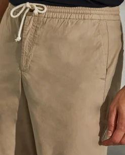 Calças regular fit de algodão com cordão