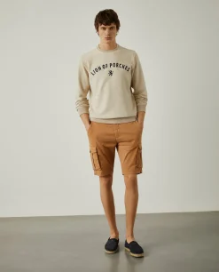 Calções bermuda com bolsos laterais