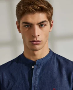 Camisa slim fit denim com carcela de polo