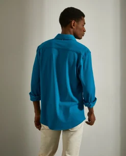 Camisa slim fit em malha piqué com carcela de polo