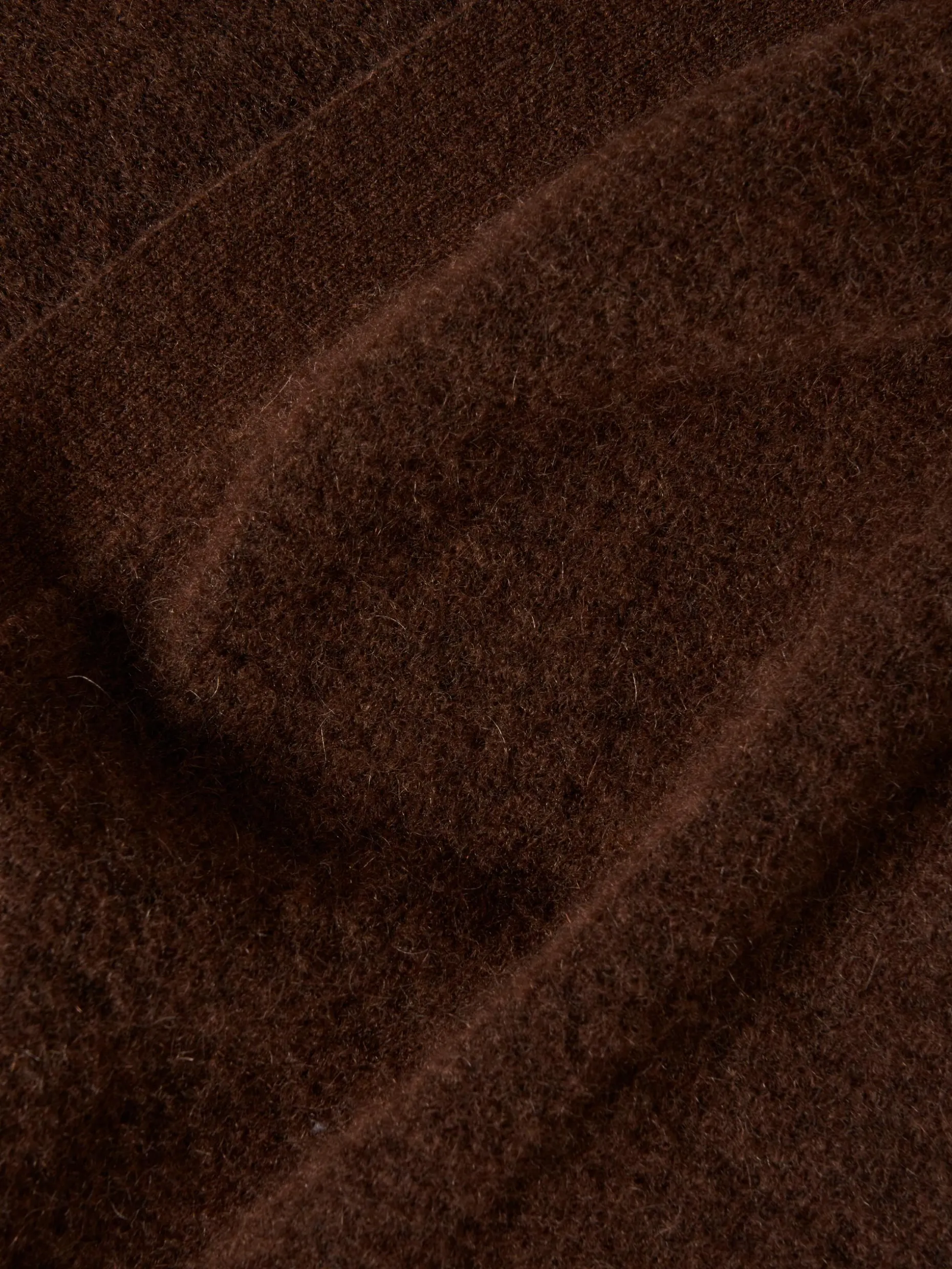 Casaco de malha comprido mangas abalonadas