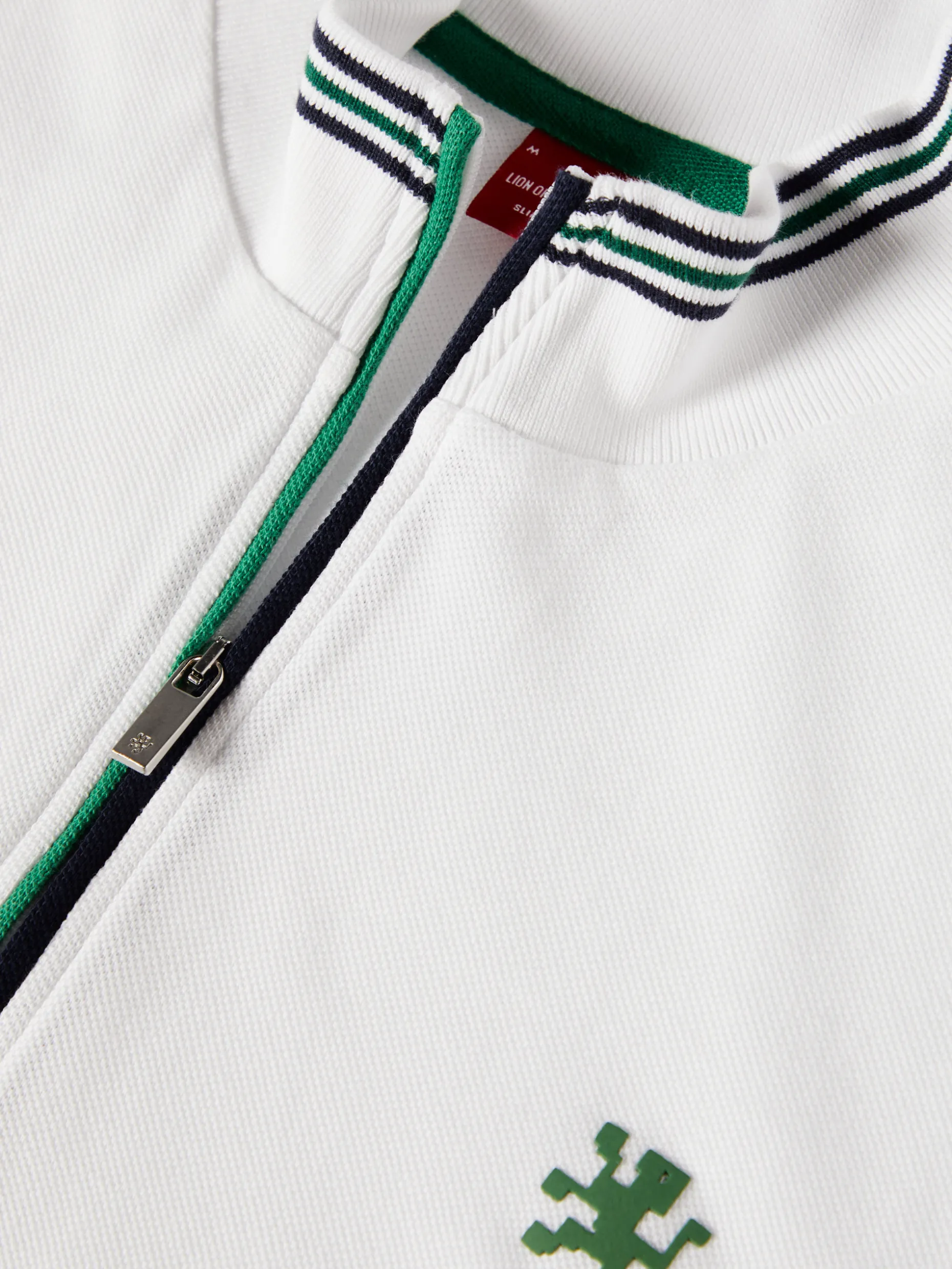 Polo piqué tricolor com fecho