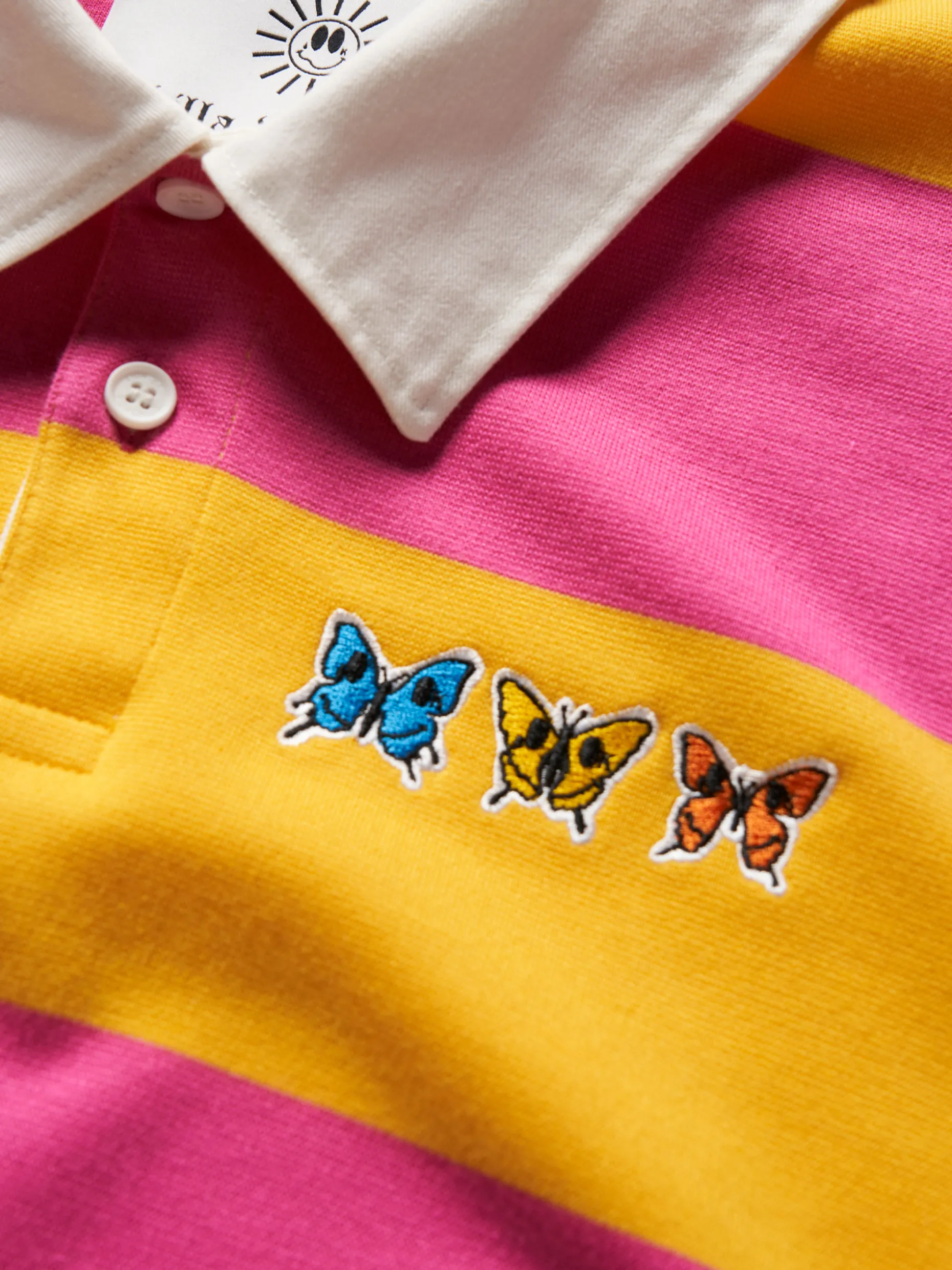 Polo rugby de manga comprida com padrão de riscas