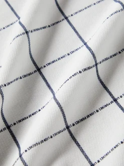 Polo slim fit com padrão quadrados