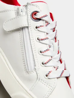 Sapatilhas unissexo em pele com cordões e fecho